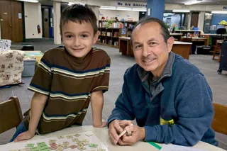 Volunteer tutoring a child